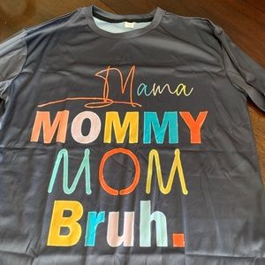 Gray. Saying is in the front and back. It’s not cotton.